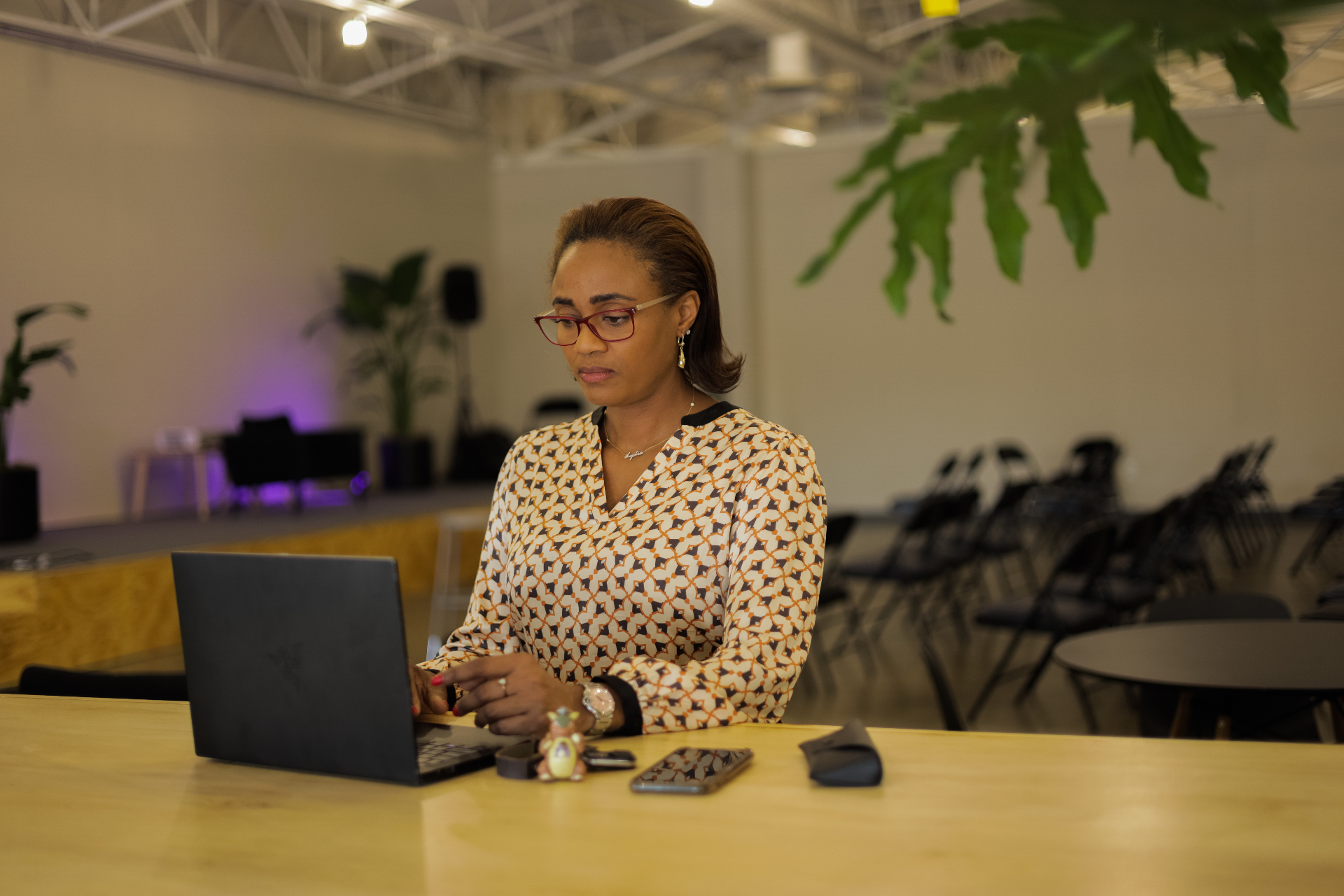 Two leaders working together in a bright plant-filled room